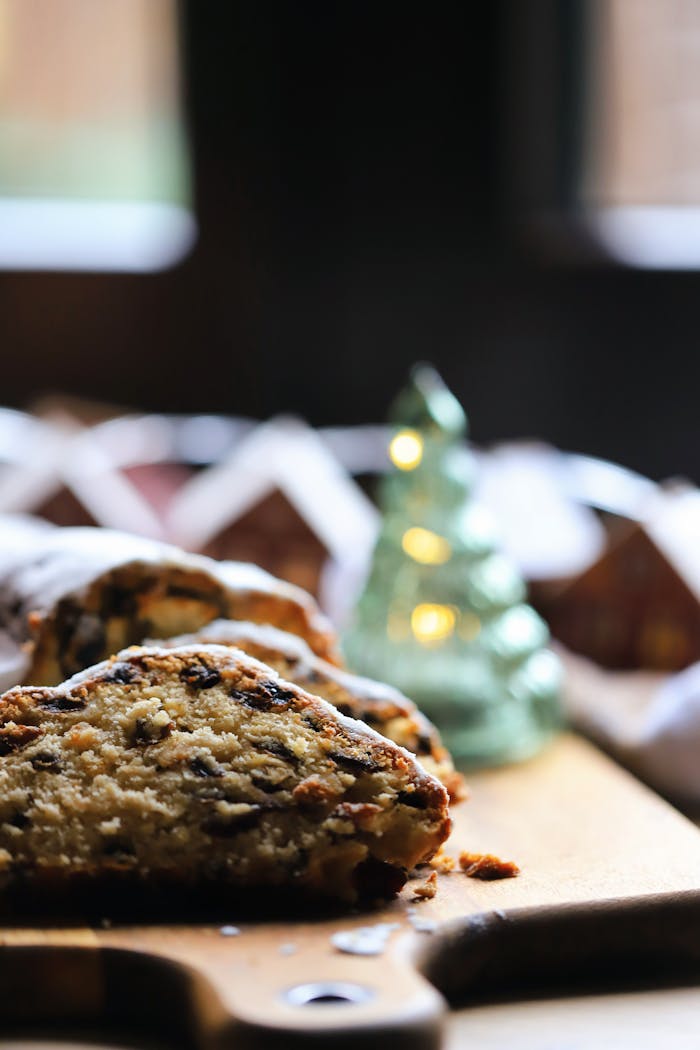 Delicious German stollen cake topped with powdered sugar, perfect for Christmas celebrations.